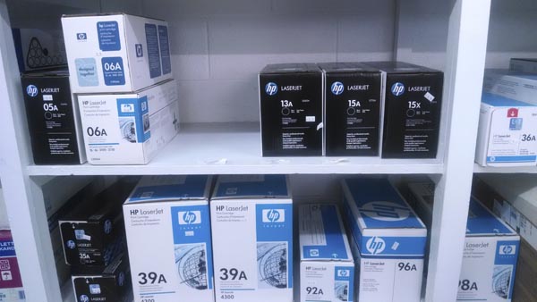 Shelves of HP laser toner cartridges